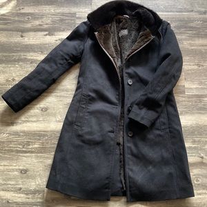 Gimo’s faux fur coat. Wool and Cashmere